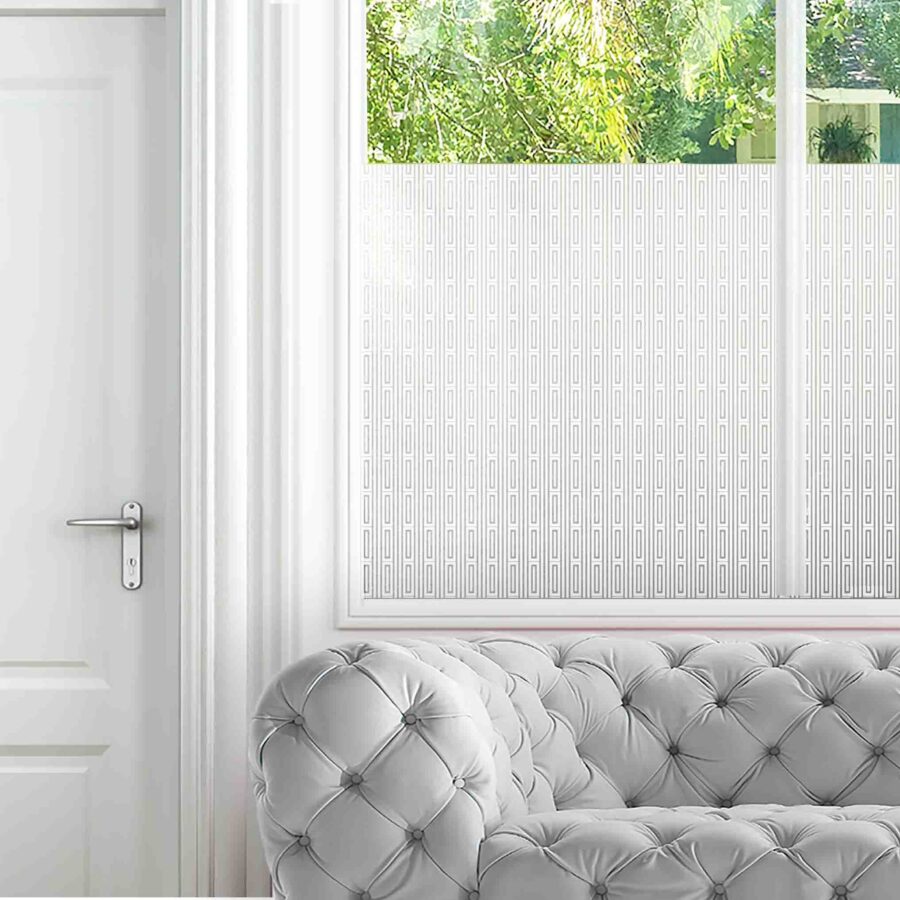 A simple all-over pattern with 2 chunky lines in a square adorns privacy film for windows in a living room.