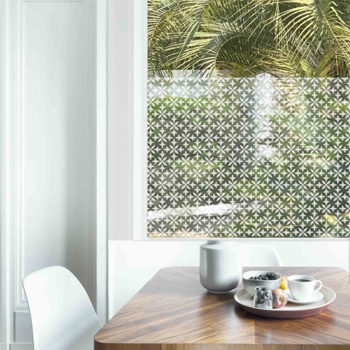 Dining table with fresh flowers and breakfast tray with coffee c Dining table with fresh flowers and breakfast tray with coffee c