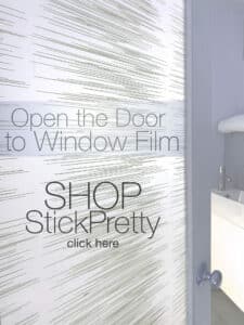 Window privacy film on a bathroom door creates privacy and features a pattern of contemporary slightly sporadic horizontal lines.